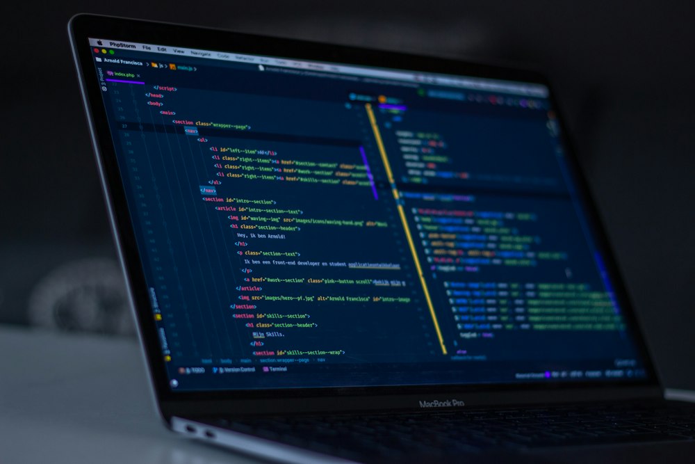 Laptop showing code on a desk